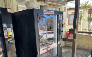 Heavy-duty vending machines on a WA mine site, stocked with cold drinks and snacks.